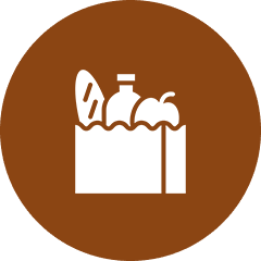 Icon of a grocery bag containing a bottle, baguette, and apple against a brown circular background, symbolizing the nurturing spirit akin to a diverse church congregation.
