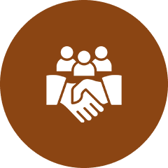 Icon of a handshake with three people above, symbolizing teamwork or collaboration, reminiscent of the community spirit often found in non-denominational churches. Brown circular background.